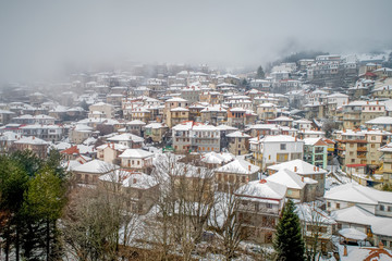 Obraz premium Aerial view of the snowy Metsovo is a town in Epirus, in the mountains of Pindus in northern Greece and attracts many visitors