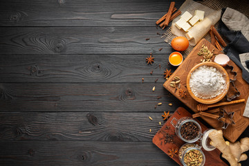 ingredients for baking ginger cookies on a rustic wooden background, view from above