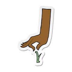 sticker of a cartoon hand picking blade of grass