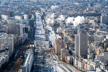 Fototapeta na wymiar Paris in winter snowy railroad tracks of Montparnasse railway station