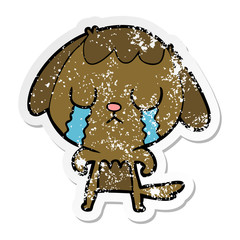 distressed sticker of a cute cartoon dog crying