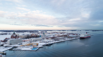 Ariel panoramic view of Helsinki at winter with a Cathedral church and Katajanokka area on the shore of Baltic Sea. Finland