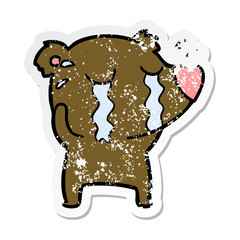 distressed sticker of a cartoon crying bear