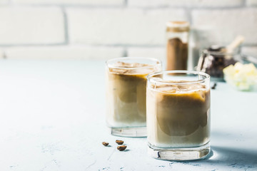Iced bulletproof cold brew coffee. Selective focus, space for text.