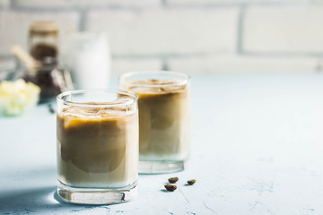 Iced bulletproof cold brew coffee. Selective focus, space for text.