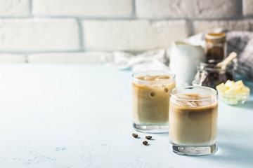 Keto iced bulletproof coffee. Selective focus, space for text.