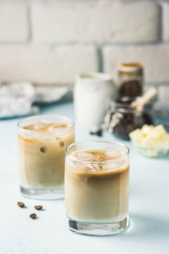 Keto iced bulletproof coffee. Selective focus, space for text.