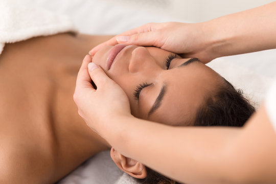 Spa face massage. Woman getting spa treatment
