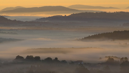 Fototapeta premium Sunrise with fog in mountains