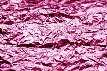 Metal foil texture in pink tone.