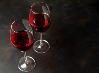 Red wine glasses on the background  stone