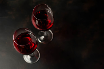 Red wine glasses on the background  stone