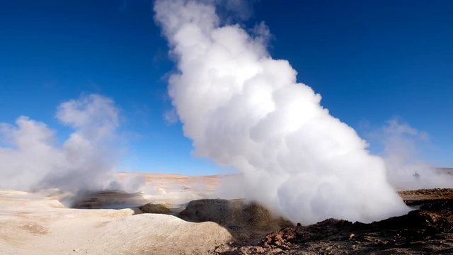 Sunshine rocky steaming geysers area in Bolivia
