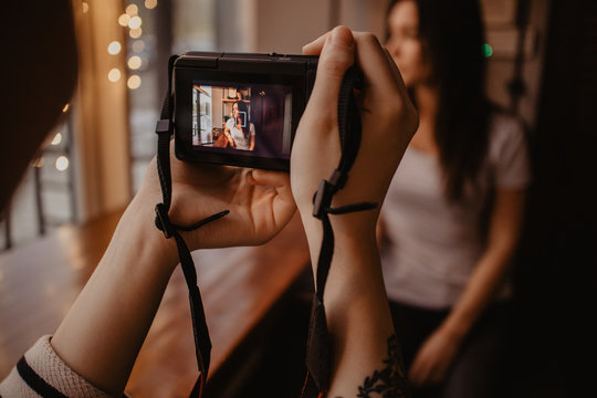 Close up of woman talking picture of her friend with camera