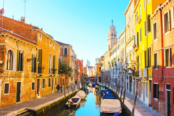 Sunny day in Venice. Narrow streets, canals and beautiful architecture.