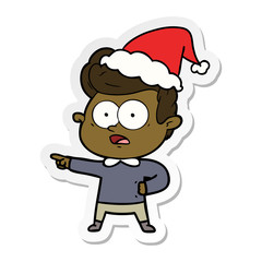 sticker cartoon of a staring man wearing santa hat