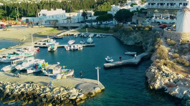 Aerial view of people fishing at pier at island Paros, Greece