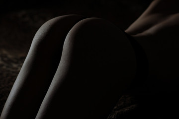 silhouette of female priests and feet at studio