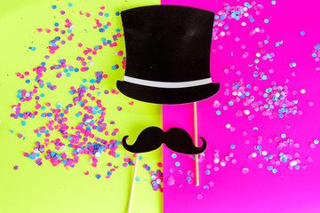 Icon of gentleman. Design with mustache and black hat on bright background with multicolored confetti. Flat design.Invitation on party or Happy Father's Day greeting card.