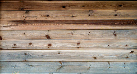 Obraz na płótnie Canvas The texture of the old log on the house. Close-up. Wooden background.