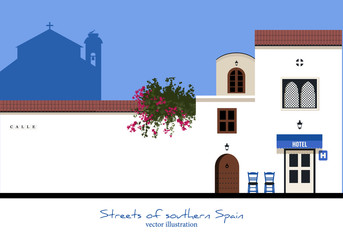 Typical street in southern Spain. Hotel and chairs. Moroccan style. Church in the background - obrazy, fototapety, plakaty