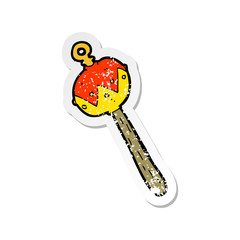 retro distressed sticker of a cartoon old rattle