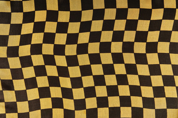 Black and gold grid fabric texture background - image