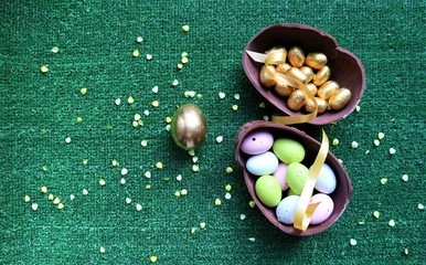 Golden Easter eggs on a green background