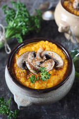 Vegetable carrot soup with mushroom and parsley dressing