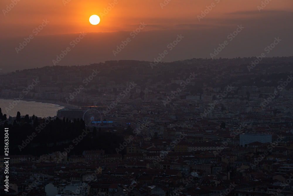 Wall mural Nice view of the city at sunset from a height