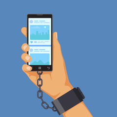 Gadgets addiction concept, hand shackled to smartphone