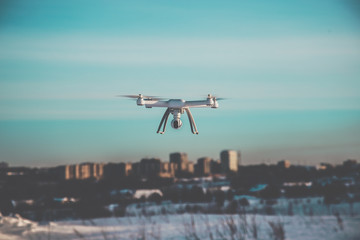 Fototapeta na wymiar radio-controlled drone flies on a clear winter day