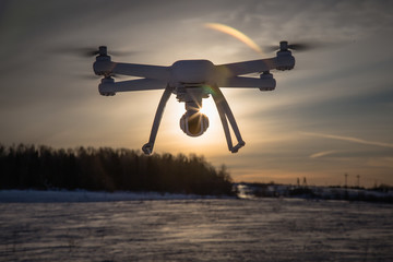 radio-controlled drone flies on a clear winter day