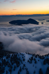 Aerial view of a beautiful Canadian Landscape during a winter sunset. Taken in Howe Sound, North of Vancouver, British Columbia, Canada.