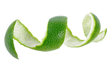 Lime skin in spiral form on a white background, healthy food.