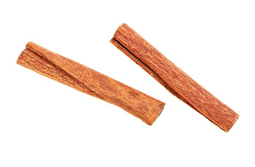 Two aromatic cinnamon sticks on white background, top view.