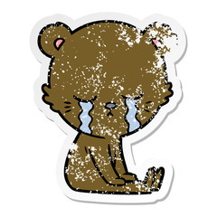 distressed sticker of a crying cartoon bear