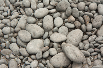 closeup round, gray, pebble background from beach in Hawaii