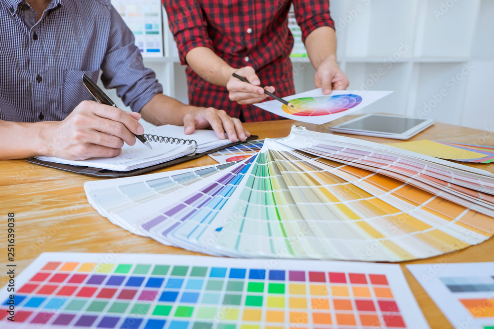 Aufkleber team of creative graphic designer meeting working on new project, choose selection color and drawing