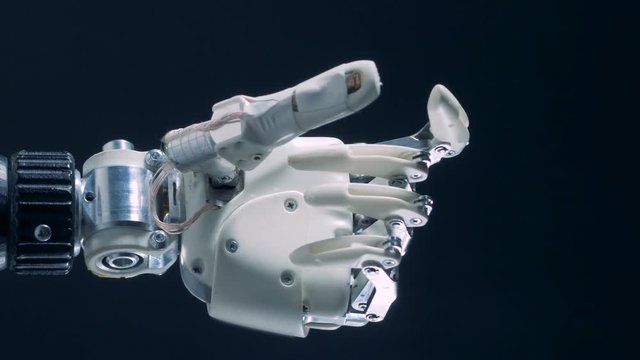 White prosthetic hand working, automated production.