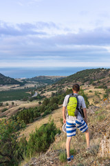 Tourist looks at the sea, view of the sea and the valley with vineyards , Vesele bay in the Sudak Municipality of the Crimea