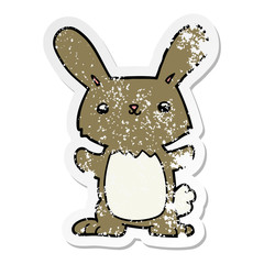 distressed sticker of a cute cartoon rabbit