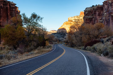 Scenic road in the desert during a vibrant sunny sunrise. Taken on Route 24, Utah, United States of America.