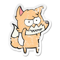 distressed sticker of a cartoon grinning fox