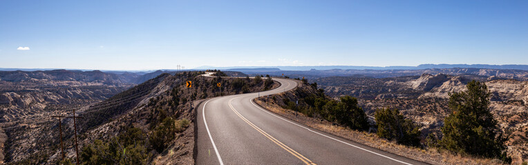 Scenic road in the desert during a vibrant sunny day. Taken on Route 12, Utah, United States of America.