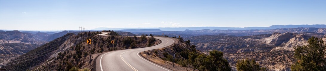 Scenic road in the desert during a vibrant sunny day. Taken on Route 12, Utah, United States of...