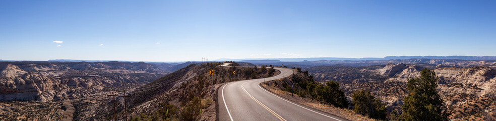 Scenic road in the desert during a vibrant sunny day. Taken on Route 12, Utah, United States of America.