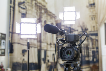 Shooting a report in the interior. Video equipment: camera, on-camera microphone gun, led lighting...