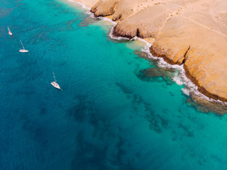 Aerial view of coast of clean blue sea