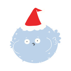 flat color illustration of a puffer fish wearing santa hat